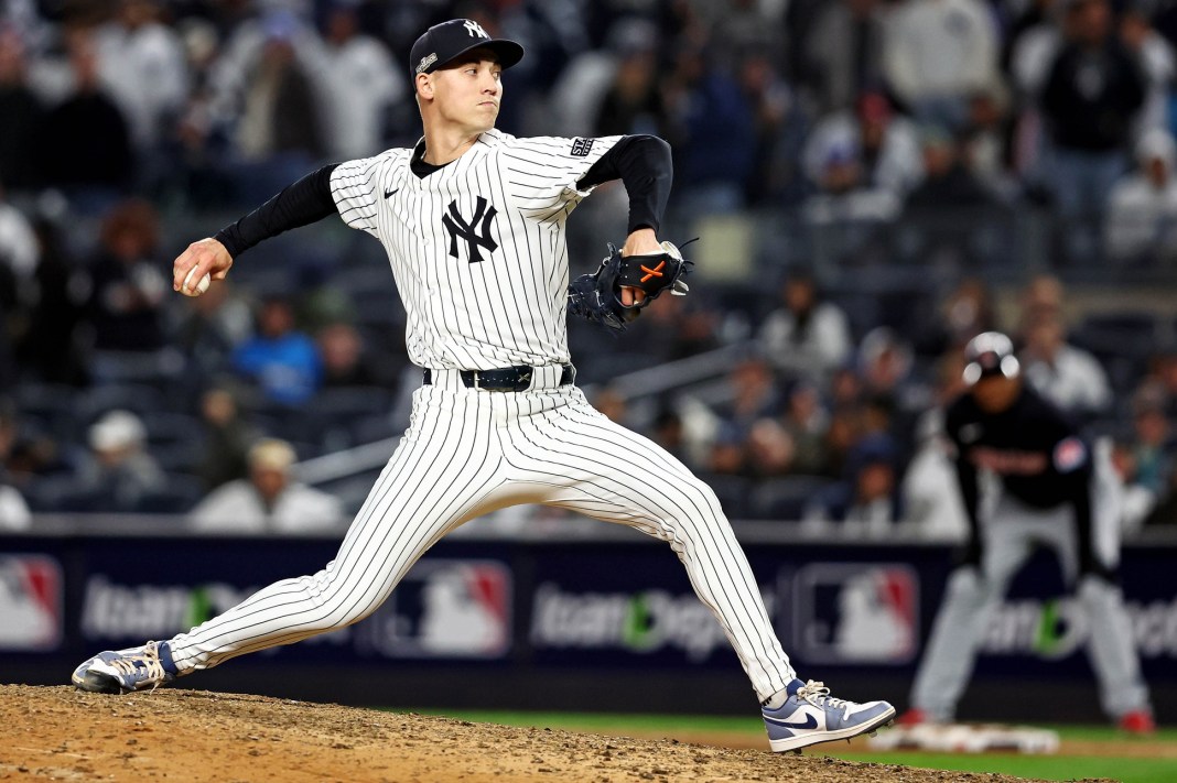 New York Yankees pitcher Luke Weaver (30) pitches during the ninth inning against the Cleveland Guardians