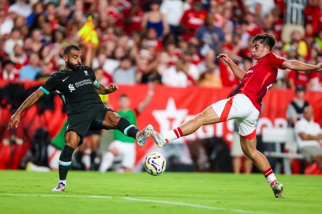 Liverpool forward Mohamed Salah (11) and Manchester United defender Harry Amass (41) battle for the ball at Williams-Brice Stadium