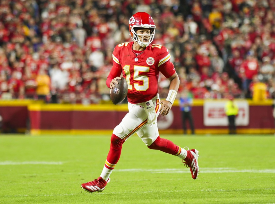 Kansas City Chiefs quarterback Patrick Mahomes (15) rolls out to pass during the first half against the New Orleans Saints