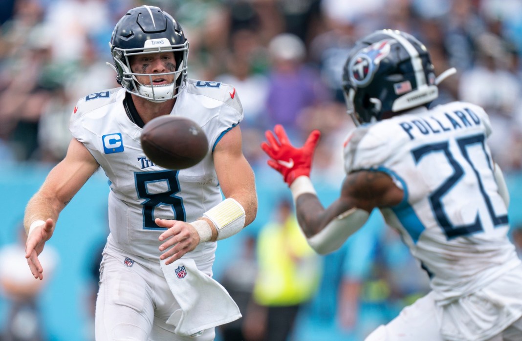 Tennessee Titans quarterback Will Levis (8) pitches to running back Tony Pollard (20) during their game at Nissan Stadium