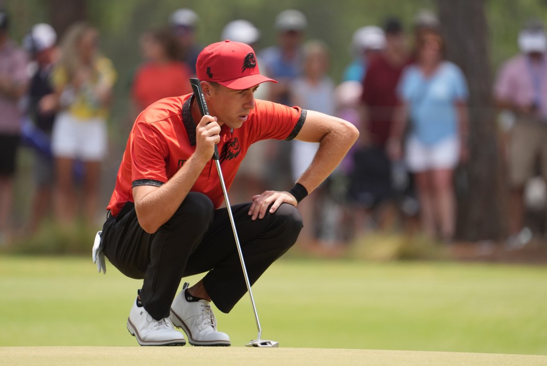 David Puig prepares to putt on the first green during the final round of the U.S. Open golf tournament