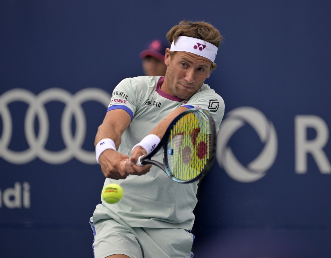 Casper Ruud hits a backhand in his match against James Duckworth in Quebec.