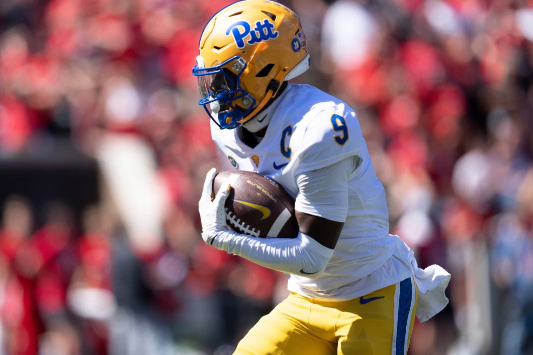 Pittsburgh Panthers wide receiver Konata Mumpfield scores a touchdown in the fourth quarter of the College Football game at Nippert Stadium.