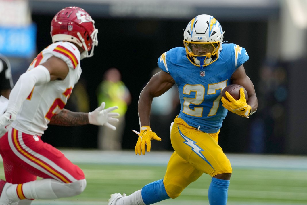 Los Angeles Chargers running back J.K. Dobbins (27) carries the ball in the first quarter against the Kansas City Chiefs at SoFi Stadium