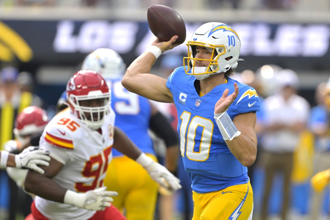 Chargers quarterback Justin Herbert looks to make a play against the Chiefs.