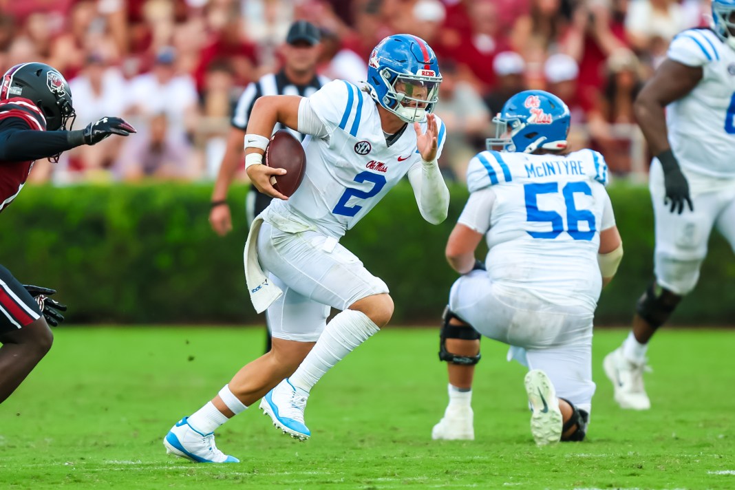 Mississippi Rebels quarterback Jaxson Dart (2) rushes against the South Carolina Gamecocks in the second quarter at Williams-Brice Stadium