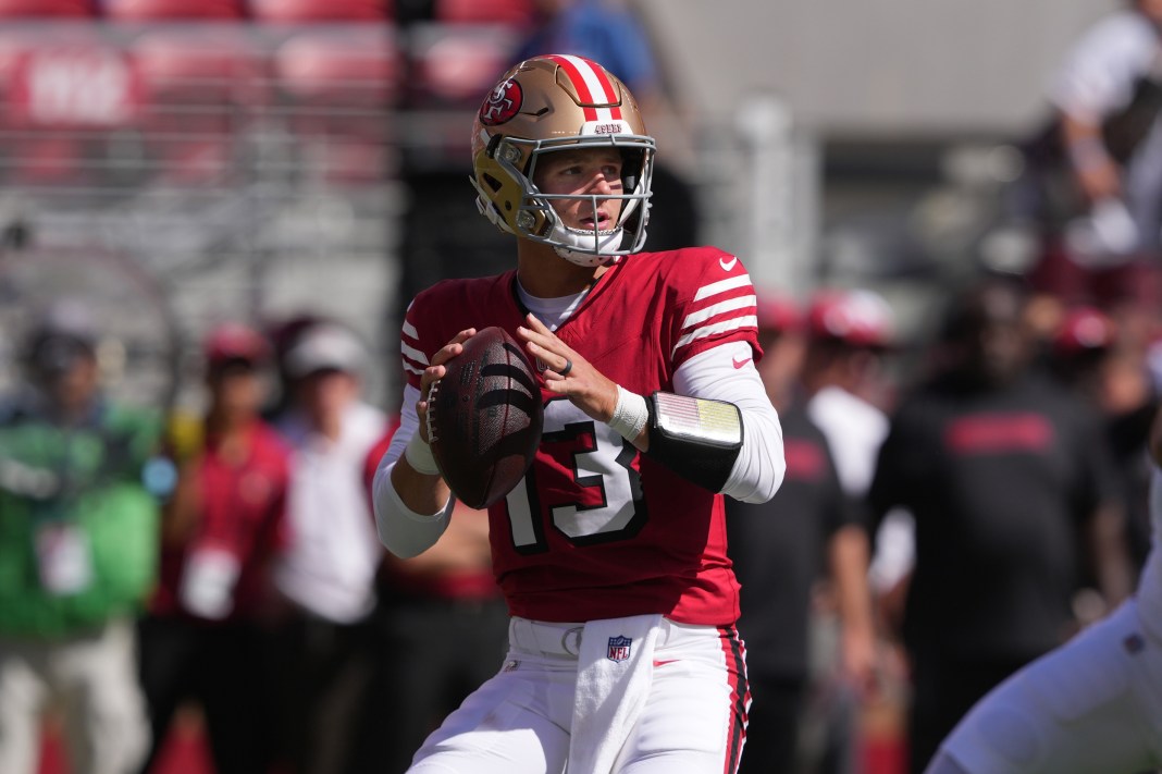 49ers quarterback Brock Purdy looks to make a play against the Cardinals in Week 5 of the 2024 NFL season.