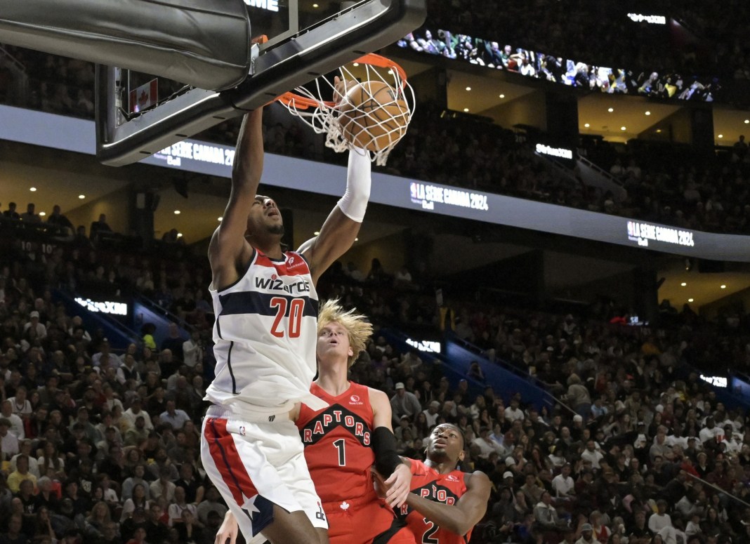 Wizards rookie Alex Sarr dunks in a preseason game against the Raptors.