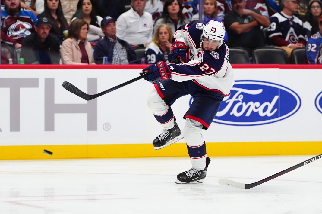 Columbus Blue Jackets center Sean Monahan (23) shoots the puck against the Colorado Avalanche in the third period at Ball Arena