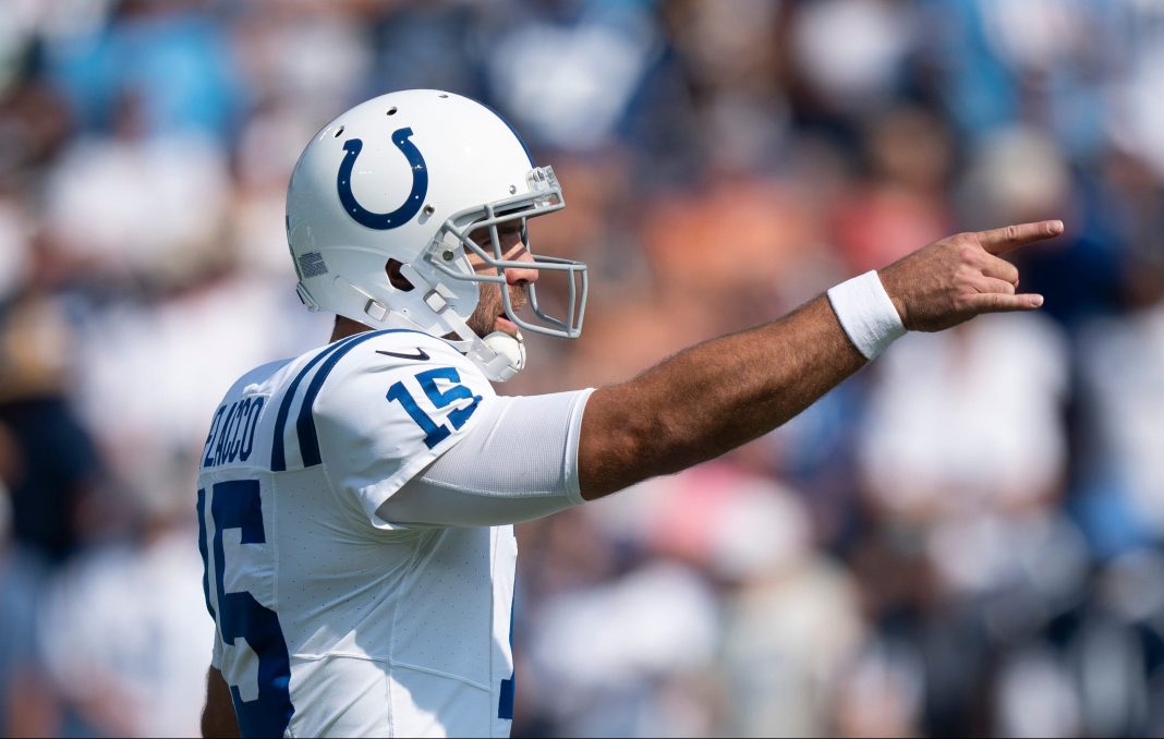 Indianapolis Colts quarterback Joe Flacco calls out to his team against the Tennessee Titans during the first half of their game at Nissan Stadium.