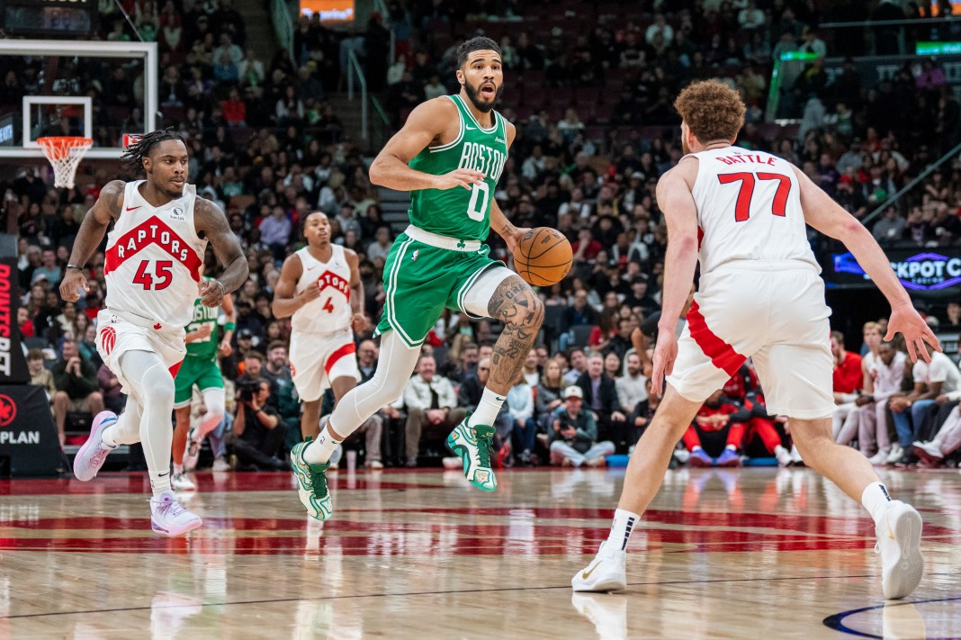 Boston Celtics forward Jayson Tatum (0) dribbles the ball against the Toronto Raptors during the first half at Scotiabank Arena