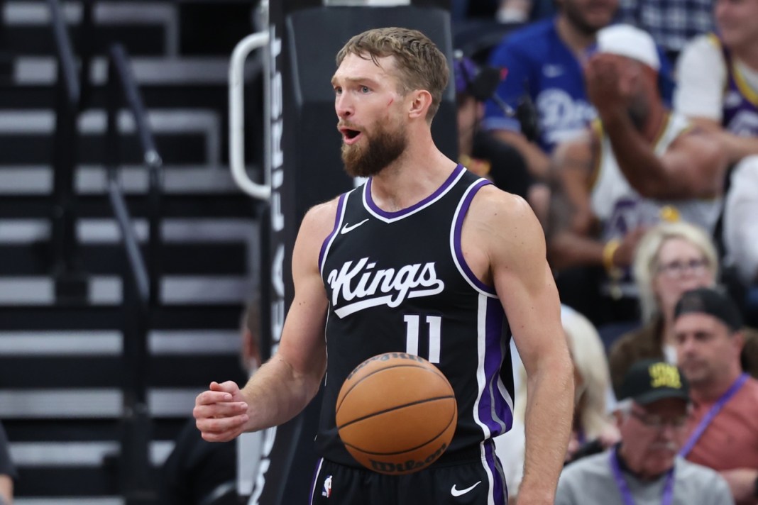 Kings star Domantas Sabonis celebrates against the Jazz in a preseason game.