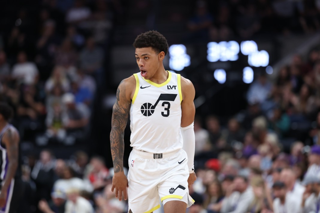 Jazz guard Keyonte George celebrates a play in a preseason game against the Kings.