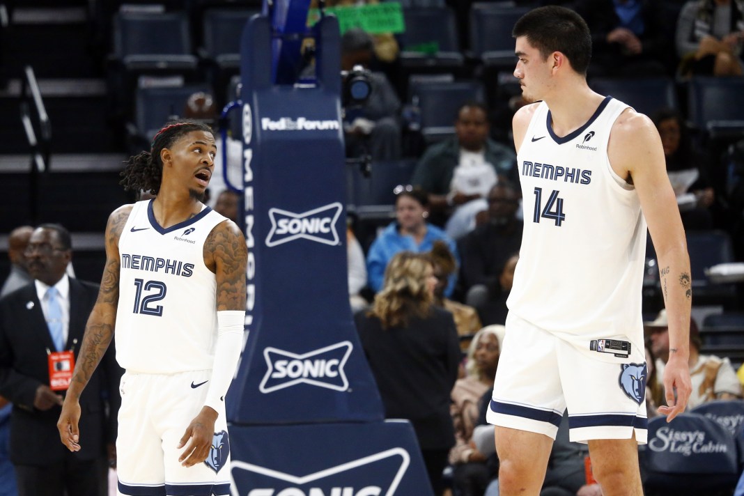 Grizzlies star Ja Morant barks out an order to rookie Zach Edey in a preseason game.