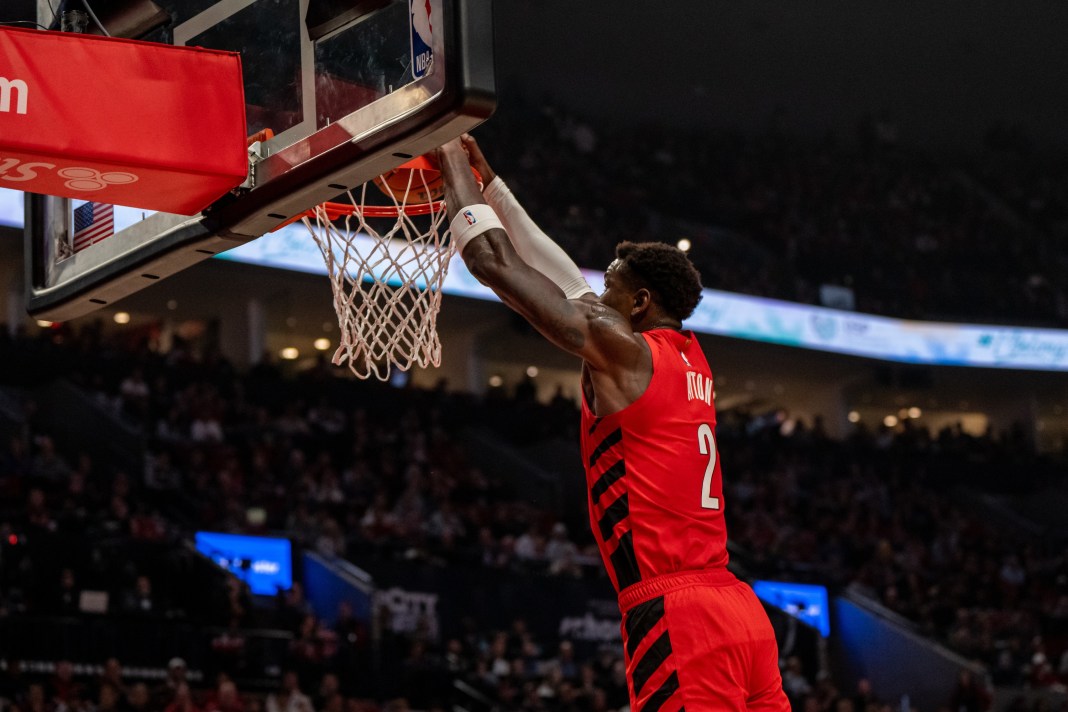 Blazers center Deandre Ayton dunks in a preseason game against the Warriors.