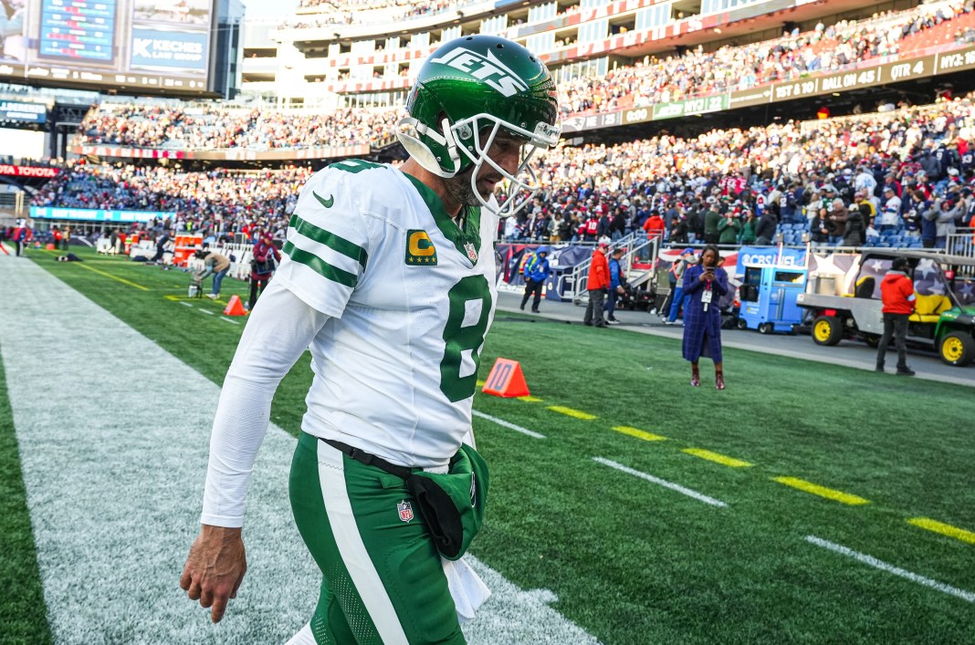 Jets quarterback Aaron Rodgers walks off the field after a loss to the Patriots in Week 8 of the 2024 NFL season.