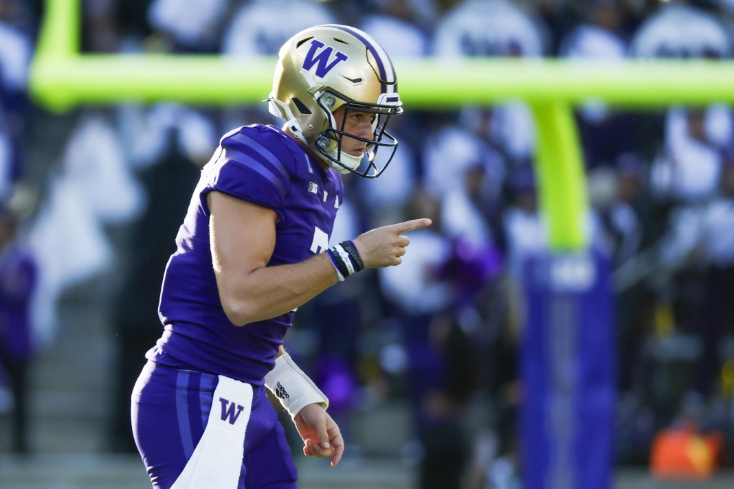 Washington Huskies quarterback Will Rogers (7) celebrates after throwing a touchdown pass against the Michigan Wolverines during the second quarter at Alaska Airlines Field at Husky Stadium