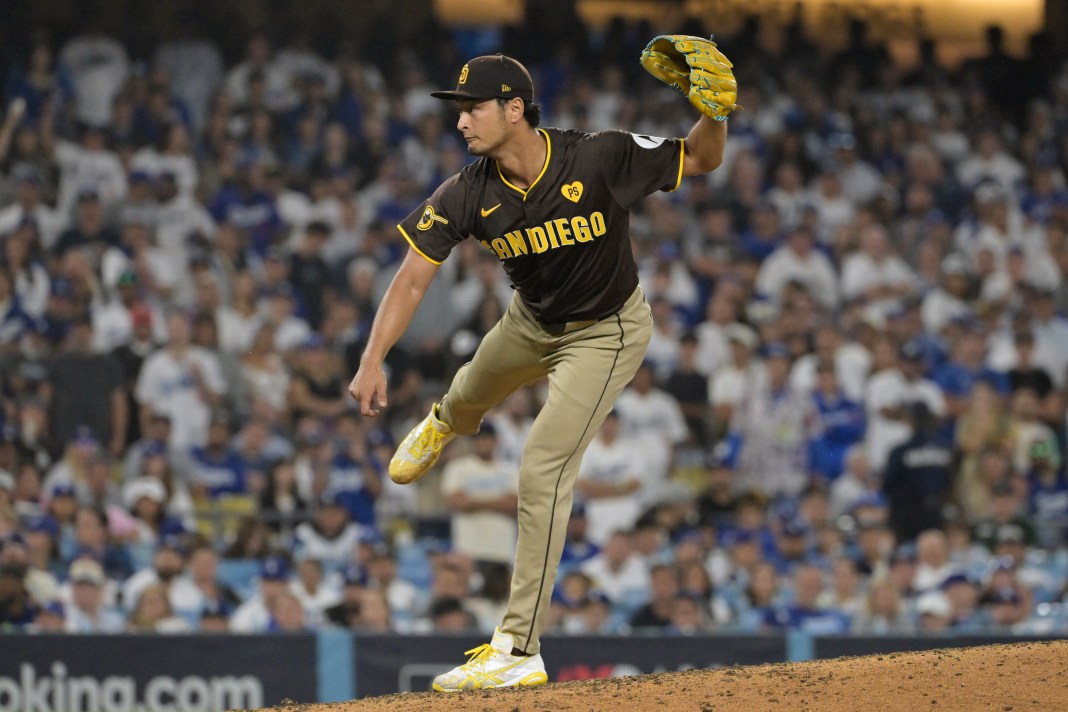 San Diego Padres pitcher Yu Darvish (11) pitches in the seventh inning against the Los Angeles Dodgers during game two of the NLDS for the 2024 MLB Playoffs at Dodger Stadium