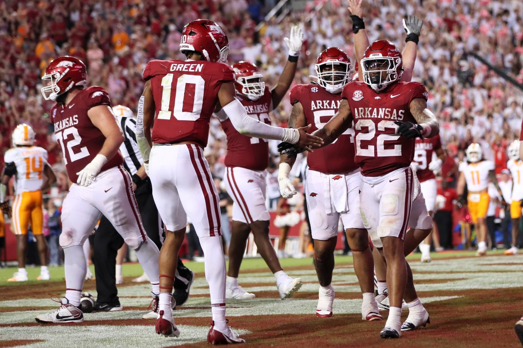 Arkansas Razorbacks running back JaÕQuinden Jackson (22) celebrates with quarterback Taylen Green (10) after scoring in the third quarter against the Tennessee Volunteers at Donald W. Reynolds Razorback Stadium