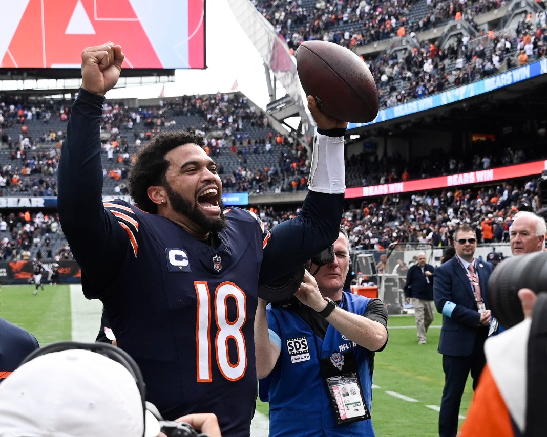 Chicago Bears quarterback Caleb Williams (18) greets fans after the second half against the Los Angeles Rams at Soldier Field