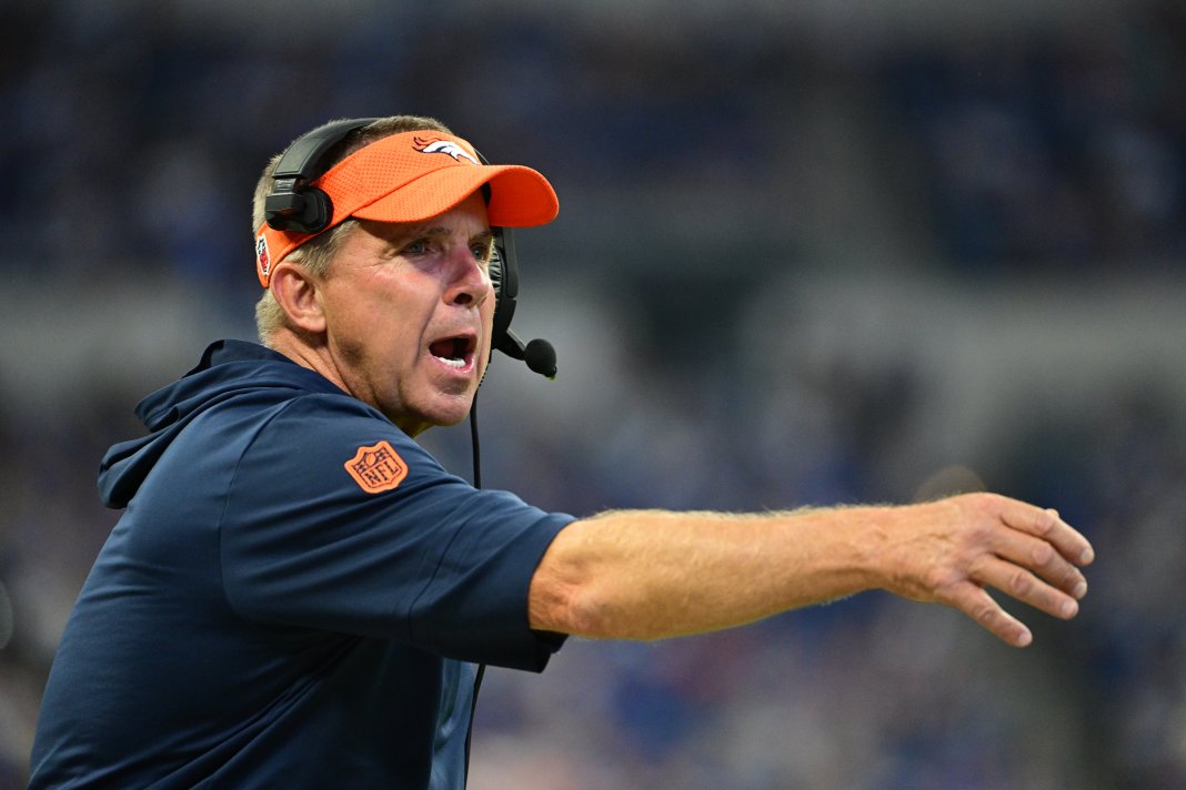 Denver Broncos Head Coach Sean Payton throws a challenge flag during the second half against the Indianapolis Colts at Lucas Oil Stadium