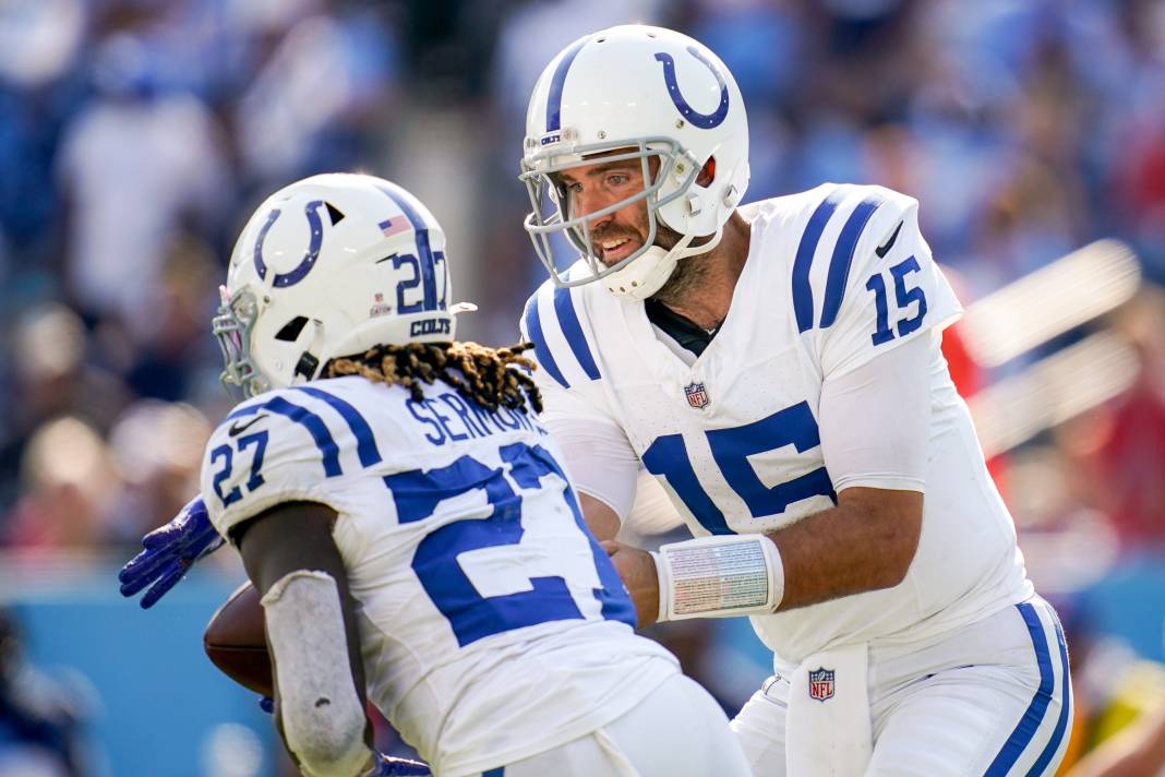 Indianapolis Colts quarterback Joe Flacco hands off to running back Trey Sermon during the fourth quarter against the Tennessee Titans at Nissan Stadium.