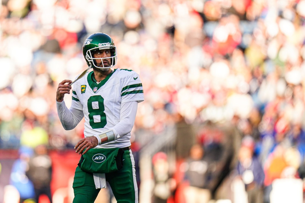 New York Jets quarterback Aaron Rodgers on the field against the New England Patriots in the second half at Gillette Stadium.