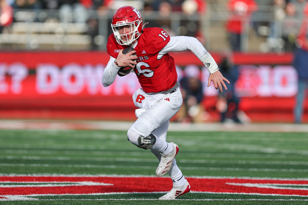 Rutgers Scarlet Knights quarterback Athan Kaliakmanis carries the ball during the second half against the Illinois Fighting Illini