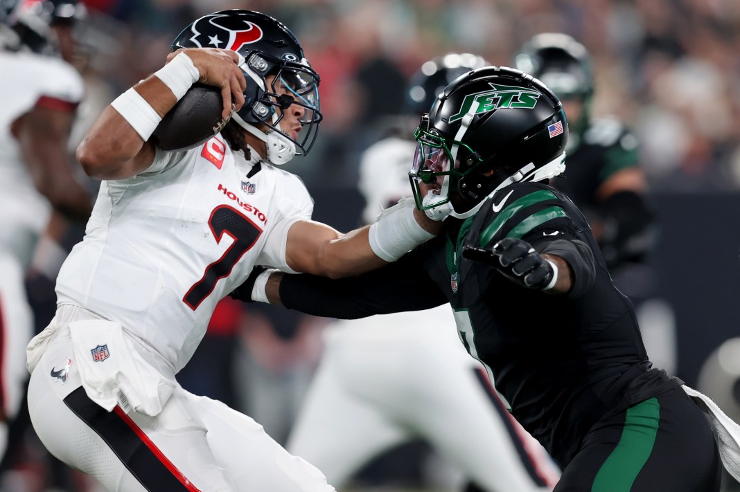 Houston Texans quarterback C.J. Stroud is pressured by New York Jets defensive end Haason Reddick during the first quarter at MetLife Stadium.