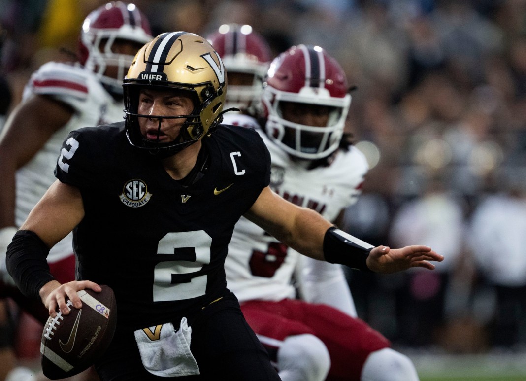 Vanderbilt Commodores quarterback Diego Pavia runs aways from South Carolina Gamecocks’s defense