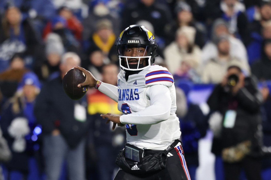 Kansas Jayhawks quarterback Jalon Daniels passes the ball