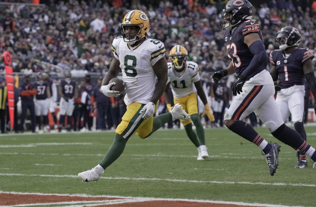 Green Bay Packers running back Josh Jacobs scores a touchdown