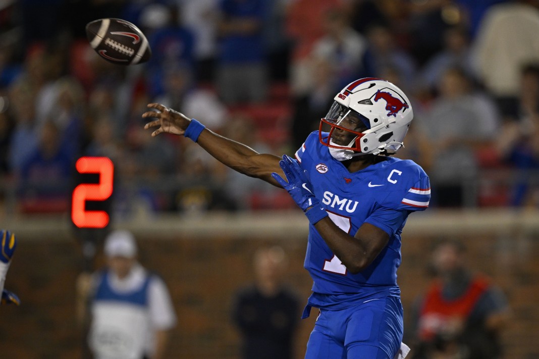 Southern Methodist Mustangs quarterback Kevin Jennings throws the ball