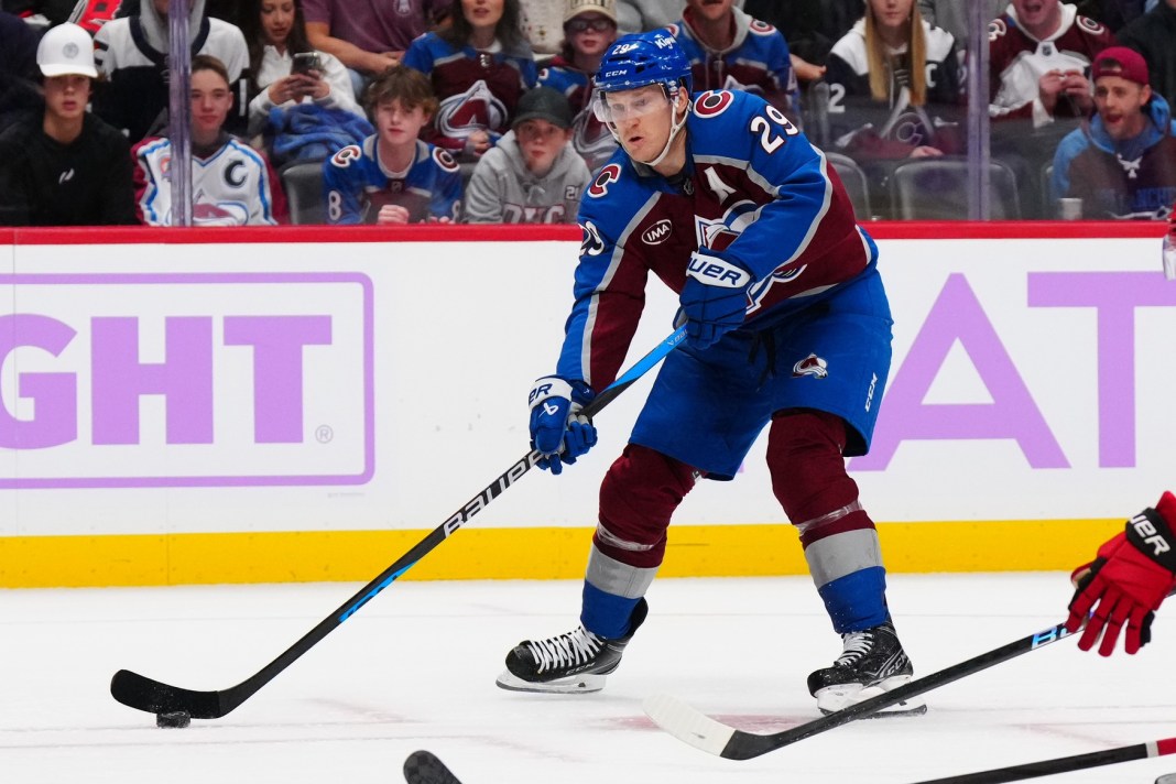 Colorado Avalanche center Nathan MacKinnon prepares to pass the puck