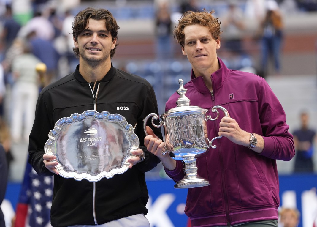 Taylor Fritz and Jannik Sinner pose with their trophies from the 2024 US Open final.