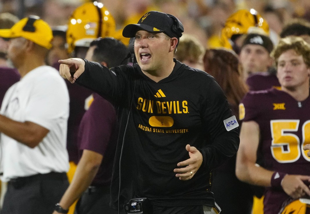 Arizona State head coach Kenny Dillingham barks out an order from the sidelines.