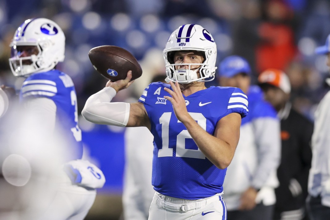 BYU quarterback Jake Retzlaff throws a pass in a meeting with Oklahoma State in the 2024 college football season.