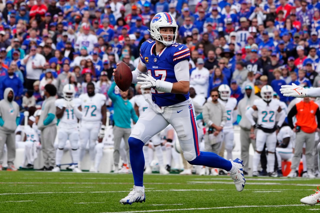 Bills star Josh Allen looks to make a play in a meeting with the Dolphins in the 2024 NFL season.