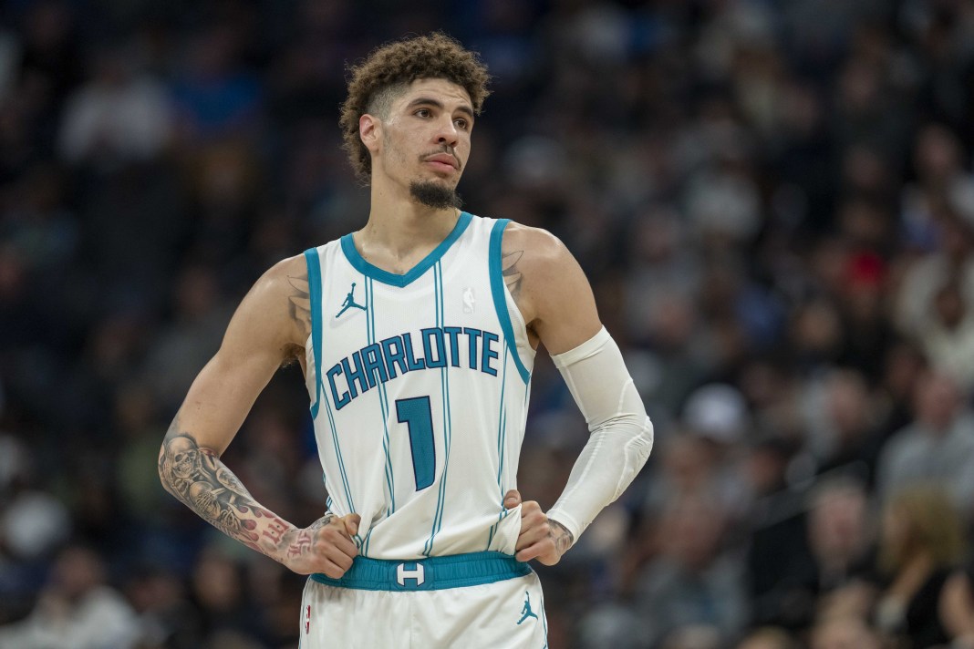 Hornets guard LaMelo Ball looks on in a meeting with the Timberwolves in the 2024-25 NBA season.