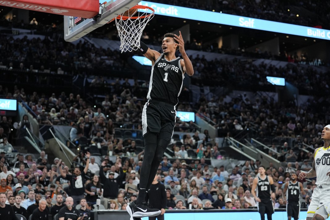 Spurs star Victor Wembanyama goes up for a dunk against the Wizards during the 2024-25 NBA season.