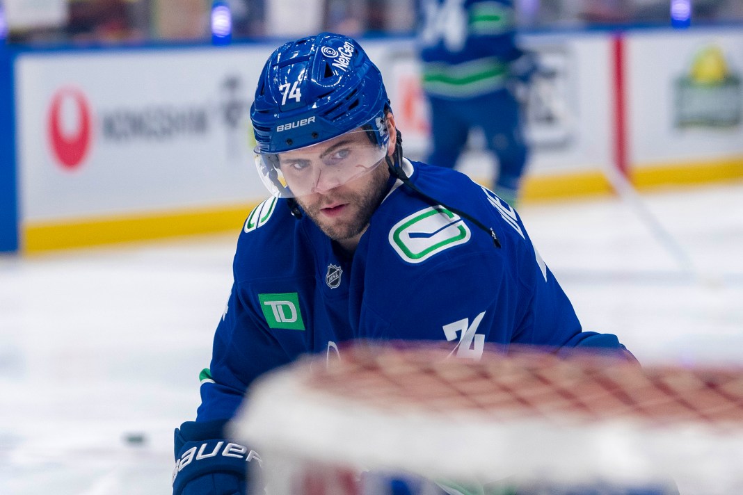 Vancouver Canucks forward Jake DeBrusk shoots during warm up prior to a game against the New York Islanders