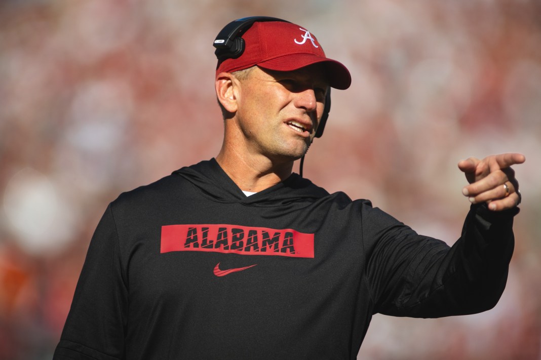 Alabama coach Kalen DeBoer gestures during a game in the 2024 college football season.