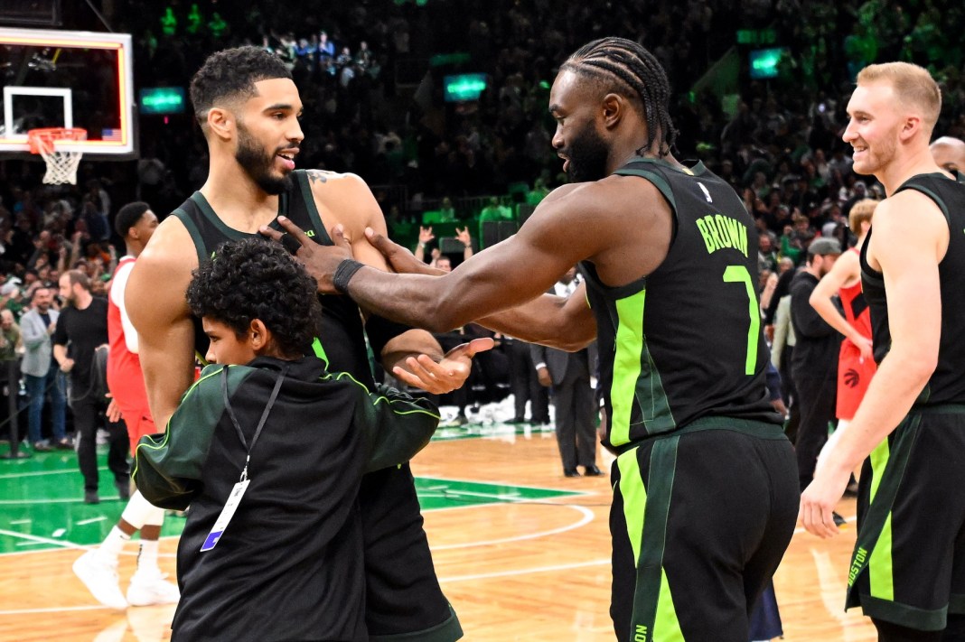 The Celtics celebrate Jayson Tatum's buzzer beater against the Raptors in the 2024-25 NBA season.