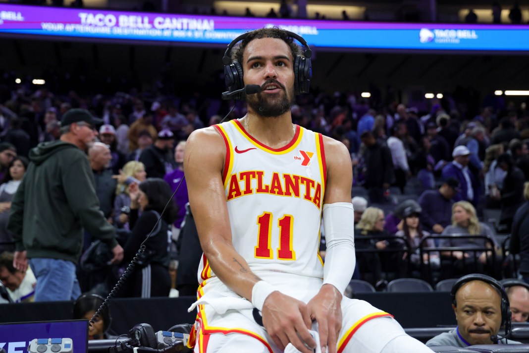 Hawks star Trae Young does an interview after a game against the Kings in the 2024-25 NBA season.