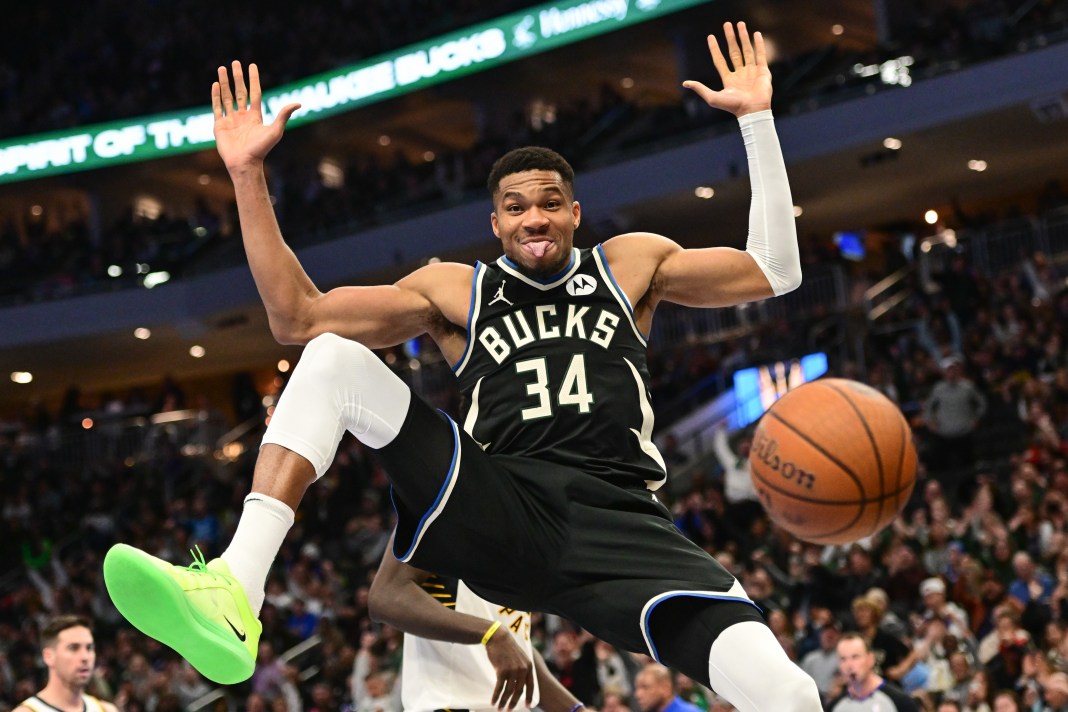 Milwaukee Bucks forward Giannis Antetokounmpo reacts after dunking a basket in the third quarter against the Indiana Pacers