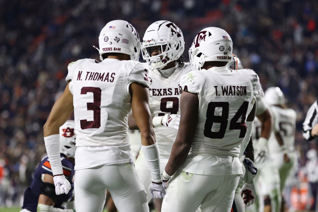 Texas A&M Aggies wide receiver Jahdae Walker celebrates with wide receiver Noah Thomas and tight end Tre Watson after scoring