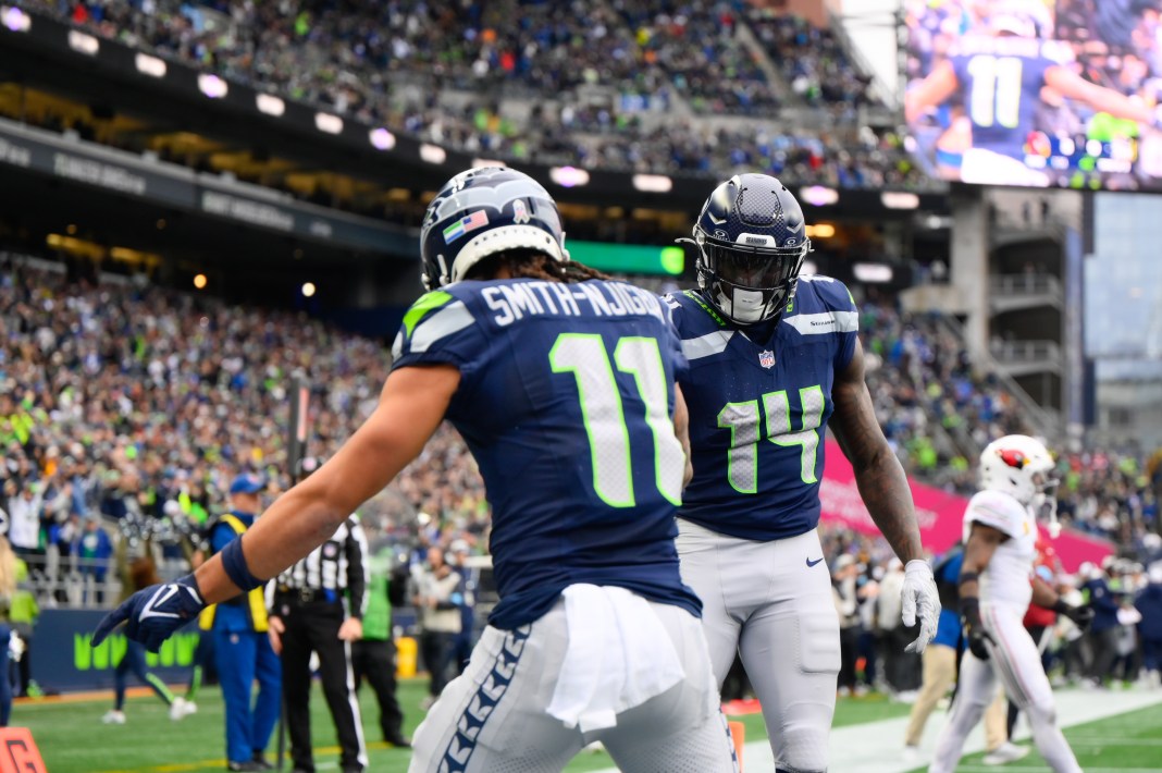 Seattle Seahawks wide receiver Jaxon Smith-Njigba and wide receiver DK Metcalf celebrate after Jaxon Smith-Njigba scored a touchdown against the Arizona Cardinals