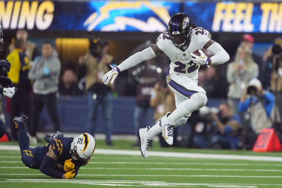 Baltimore Ravens running back Derrick Henry carries the ball