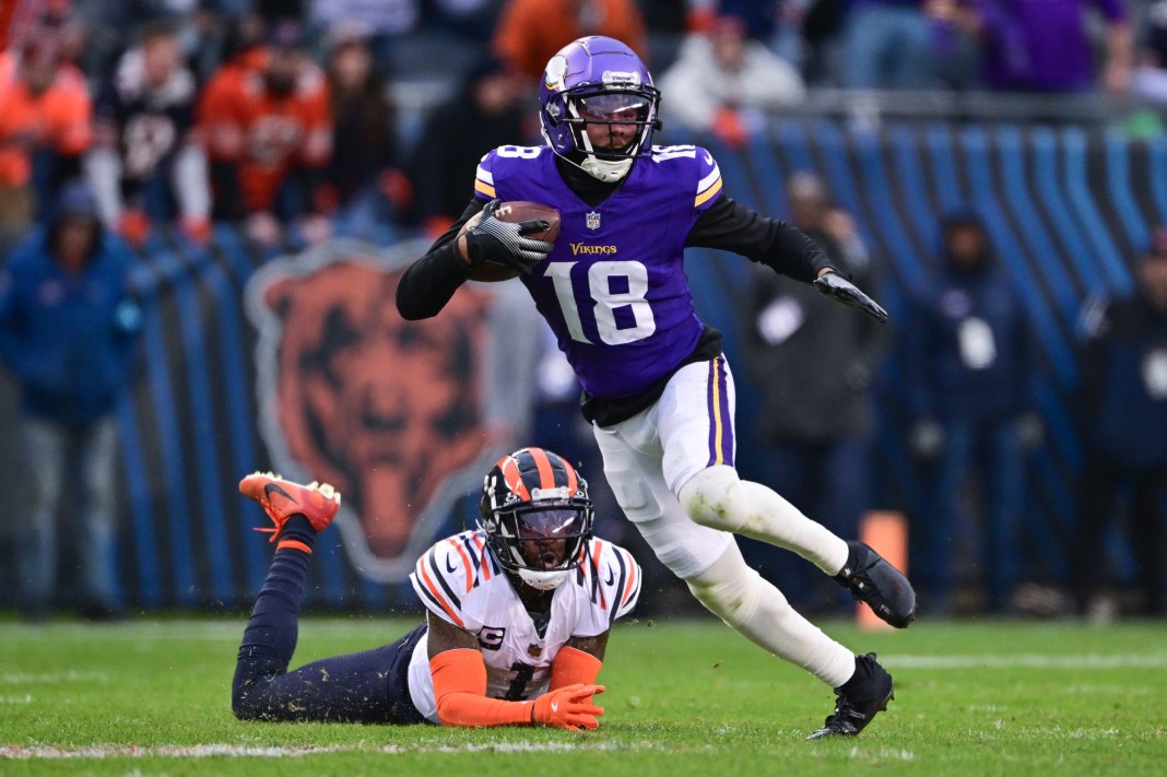 Minnesota Vikings wide receiver Justin Jefferson runs after a catch against the Chicago Bears during overtime at Soldier Field