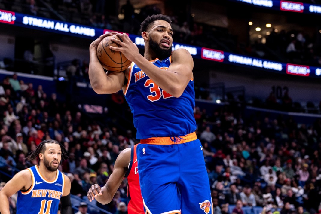 New York Knicks center Karl-Anthony Towns rebounds the ball during the second half of the game against the New Orleans Pelicans at Smoothie King Center on December 21, 2024